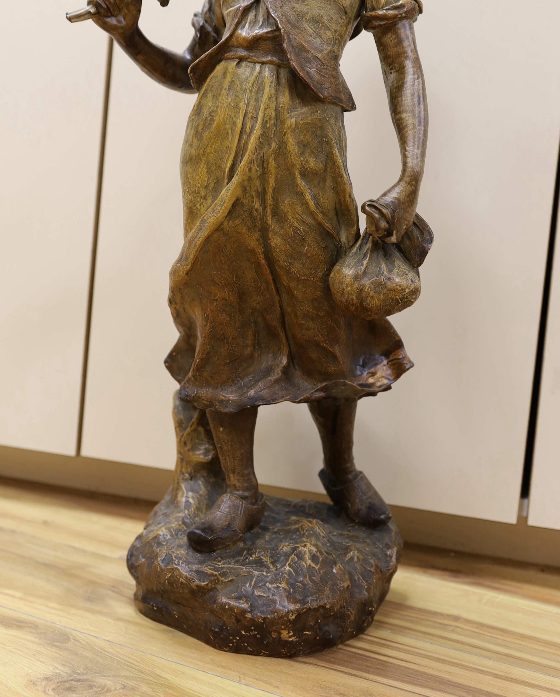 A Van Hasselt earthenware figure, signed by artist to base, 73cm